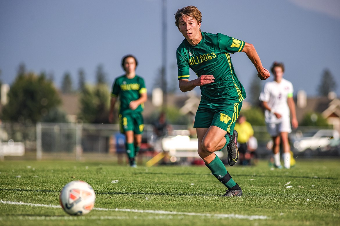 Sophomore midfielder Elijah Adams-Griffin sprints to the ball on Thursday in Whitefish against Columbia Falls. (JP Edge/Hungry Horse News)