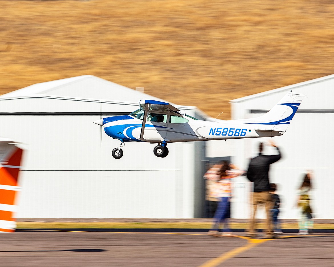 Visitors wave goodbye during Saturday’s Experimental Aircraft Association’s local Chapter 1122 sponsored fly-in a pancake breakfast. (Rob Zolman/Lake County Leader)