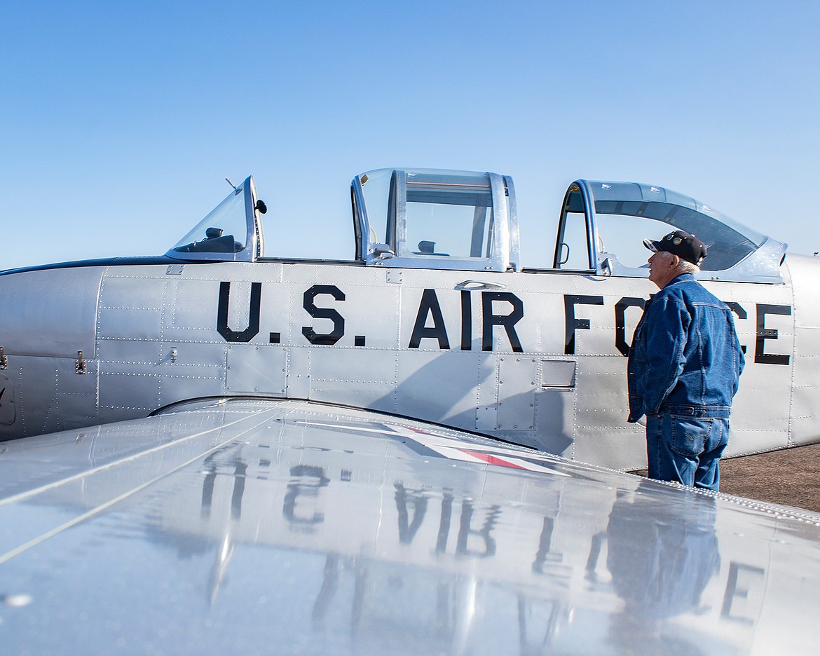 An aviation enthusiast checks out a vintage trainer during Saturday’s Experimental Aircraft Association’s local Chapter 1122 sponsored fly-in a pancake breakfast. (Rob Zolman/Lake County Leader)