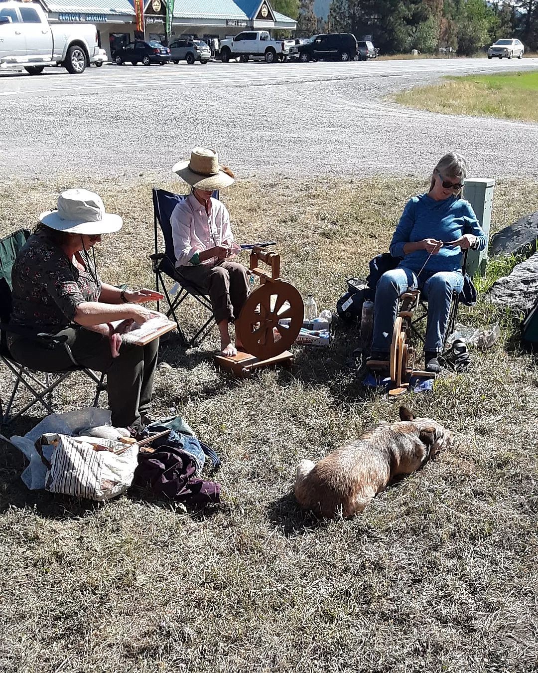 A group of women from the Alpine Spinners and Weavers Guild celebrate international "Spin Outside in Public" day at Fiber in Bigfork. (Photo provided)
