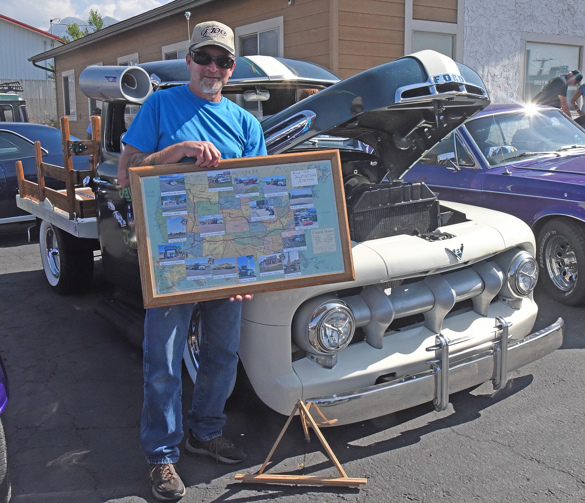 This old car enthusiast holds a map of the U.S. in front of his old Ford truck showing where he stopped with this antique vehicle. He took the trip this past May making a loop beginning in Montana, going as far East as Kentucky coming back on a Southern route to Arizona and then heading North through Utah and Idaho. (Marla Hall/Lake County Leader)