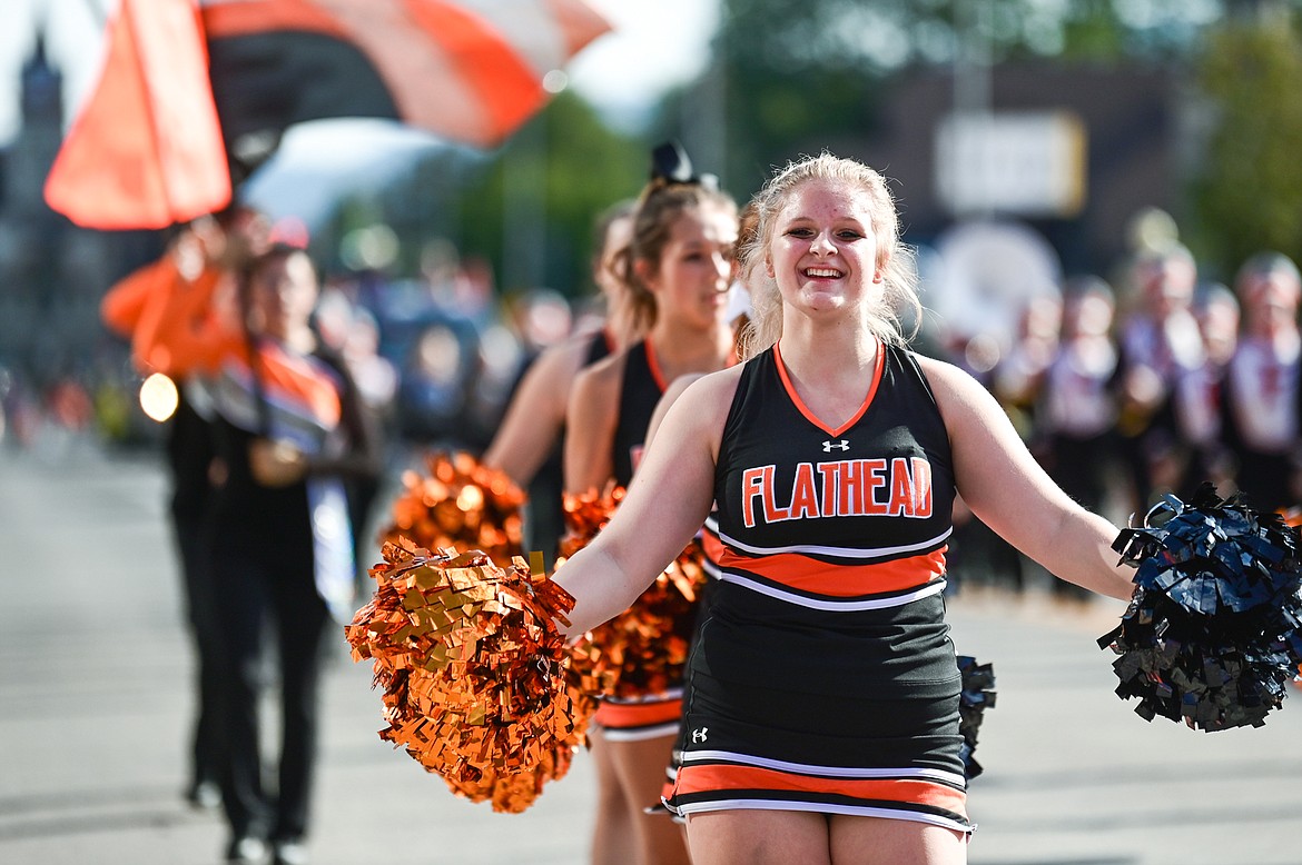 Cheerleaders lead the procession during the Flathead High School Homecoming Parade along Main Street on Wednesday, Sept. 21. (Casey Kreider/Daily Inter Lake)