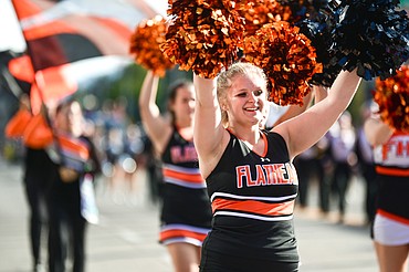 Cheerleaders lead the procession during the Flathead High School Homecoming Parade along Main Street on Wednesday, Sept. 21. (Casey Kreider/Daily Inter Lake)
