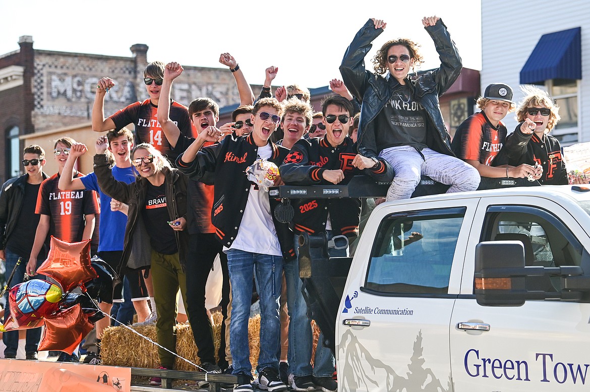 The Braves boys soccer team rides in the procession during the Flathead High School Homecoming Parade along Main Street on Wednesday, Sept. 21. (Casey Kreider/Daily Inter Lake)