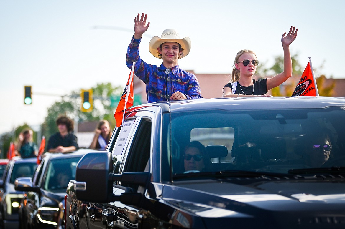 Freshman prince Bryson Carter and freshman princess Madeline Brooks ride in the homecoming royalty procession during the Flathead High School Homecoming Parade along Main Street on Wednesday, Sept. 21. (Casey Kreider/Daily Inter Lake)
