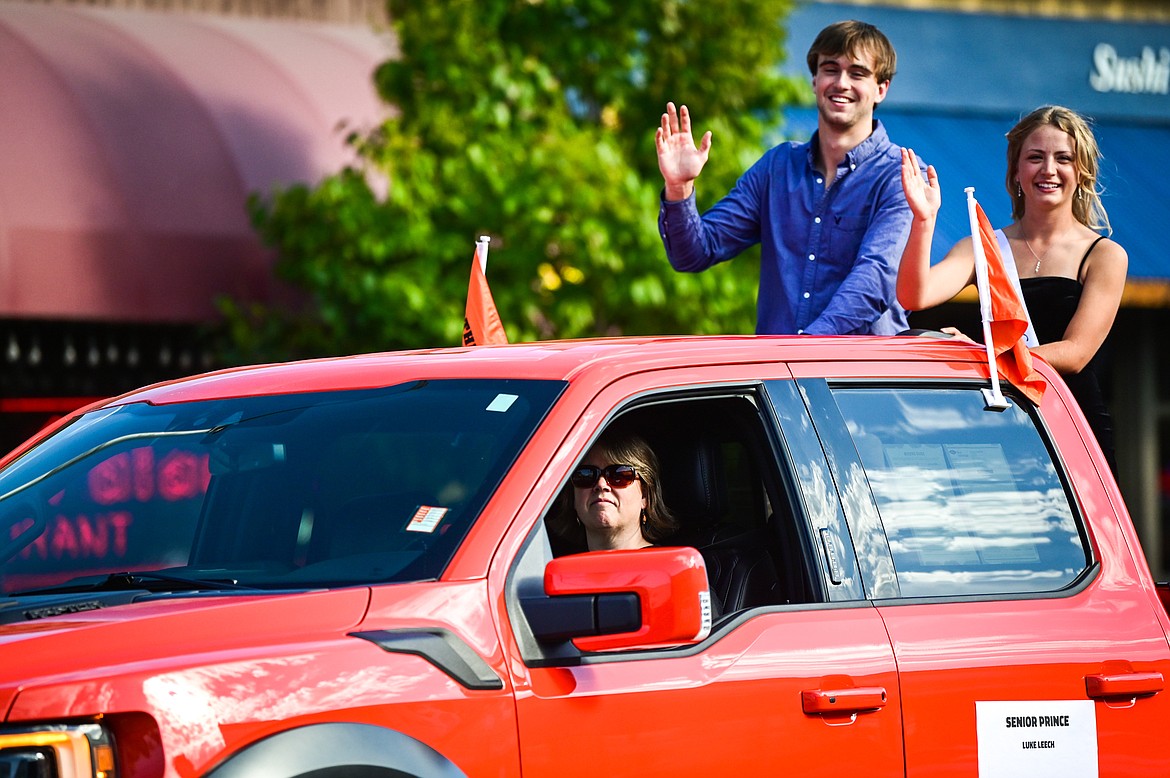 Members of the homecoming royalty ride in the procession during the Flathead High School Homecoming Parade along Main Street on Wednesday, Sept. 21. (Casey Kreider/Daily Inter Lake)