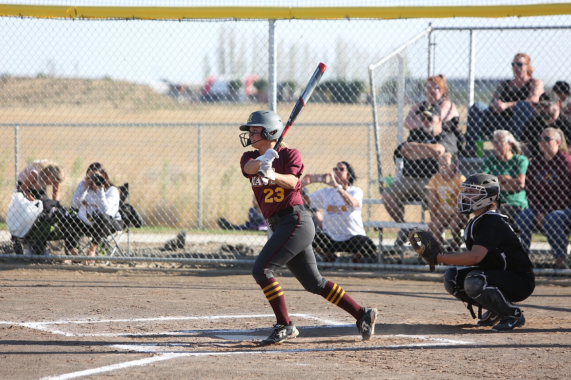 Moses Lake senior Katelyn Kriete looks on after hitting on a pitch during Moses Lake’s 10-0 win over Hermiston.