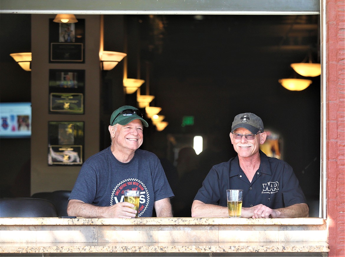Bruce Darby, left, and Steve Hamilton enjoy beers at the Coeur d'Alene Eagles Lodge on Sherman Avenue on Wednesday.