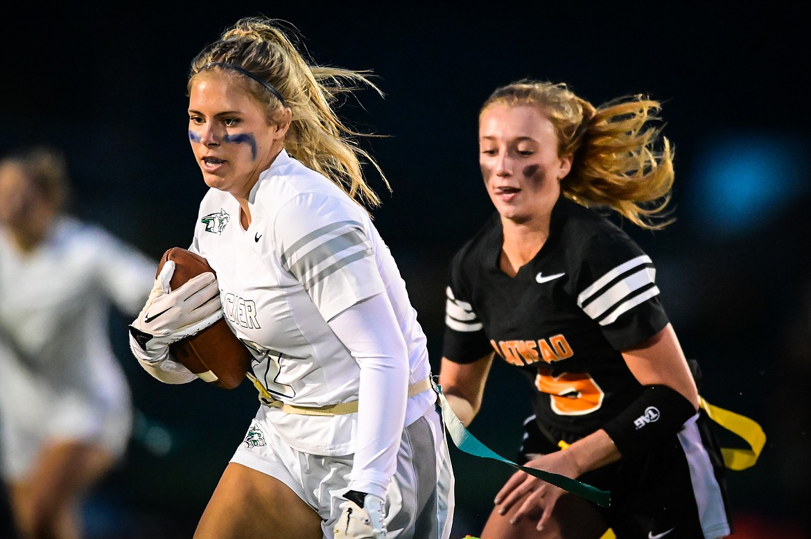 Glacier's Aubrey Price (12) is tackled from behind by Flathead's Harlie Roth (12) after a reception at Legends Stadium on Thursday, Sept. 22. (Casey Kreider/Daily Inter Lake)