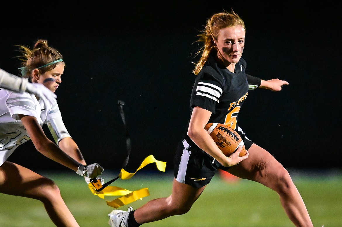 Flathead quarterback Harlie Roth (6) is tackled by Glacier's Morgan Smith (35) in the first half at Legends Stadium on Thursday, Sept. 22. (Casey Kreider/Daily Inter Lake)