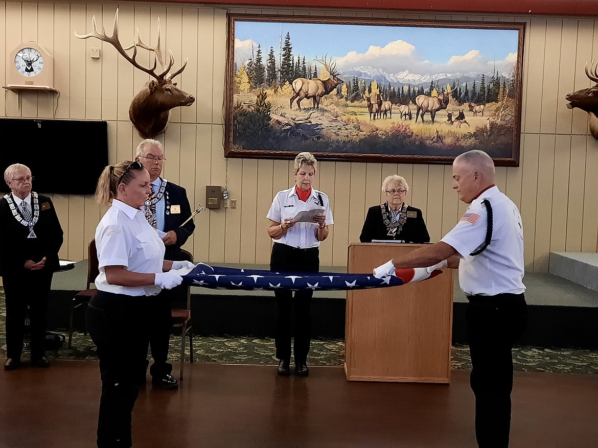 Kalispell Elks hold U.S. flag folding demonstration

Members of the United Veterans of the Flathead Valley presented a U.S. flag
folding demonstration to Elks members at a recent meeting. Elks member Mary
Lou Fitzpatrick, who serves as the captain of the Guard for the organization, read
the meaning of each of the 13 folds. UV members Laura and Dan Reese folded
the flag. 
United Veterans primarily performs military funeral honors here in the
Flathead Valley and are always looking for new members. Contact Mary Lou at
unitedvetsfv@gmail.com if you are interested.
Pictured are, in front, Laura and Dan Reese, United Veteran members; and in back are Elks members Carol Beaudion, treasurer, Steve Kelly, esquire, Mary Lou Fitzpatrick, captain of the Guard, United Veterans; and Millie Mitchke, exalted ruler.