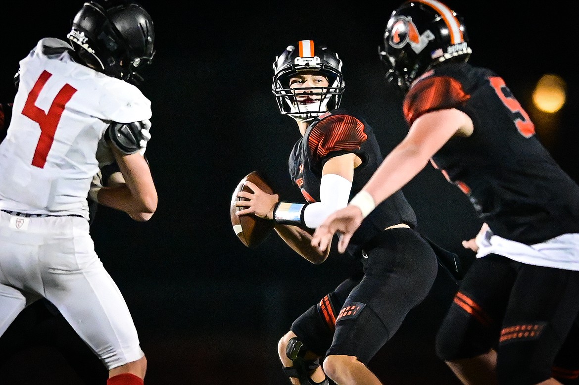 Flathead quarterback Jackson Walker (2)  looks for an open receiver in the third quarter against Missoula Hellgate at Legends Stadium on Friday, Sept. 23. (Casey Kreider/Daily Inter Lake)