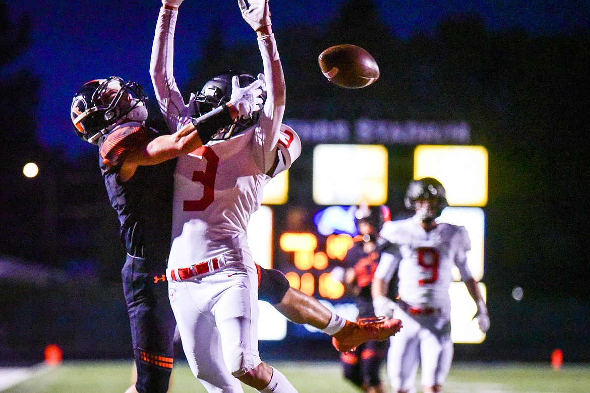 Missoula Hellgate strong safety Colin O'Leary defends a pass to Flathead's Jaden Williams in the first half at Legends Stadium on Friday, Sept. 23. (Casey Kreider/Daily Inter Lake)