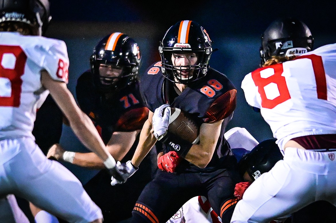 Flathead kick returner Brody Thornsberry (88) looks for an opening on a kickoff return against Missoula Hellgate at Legends Stadium on Friday, Sept 23. (Casey Kreider/Daily Inter Lake)