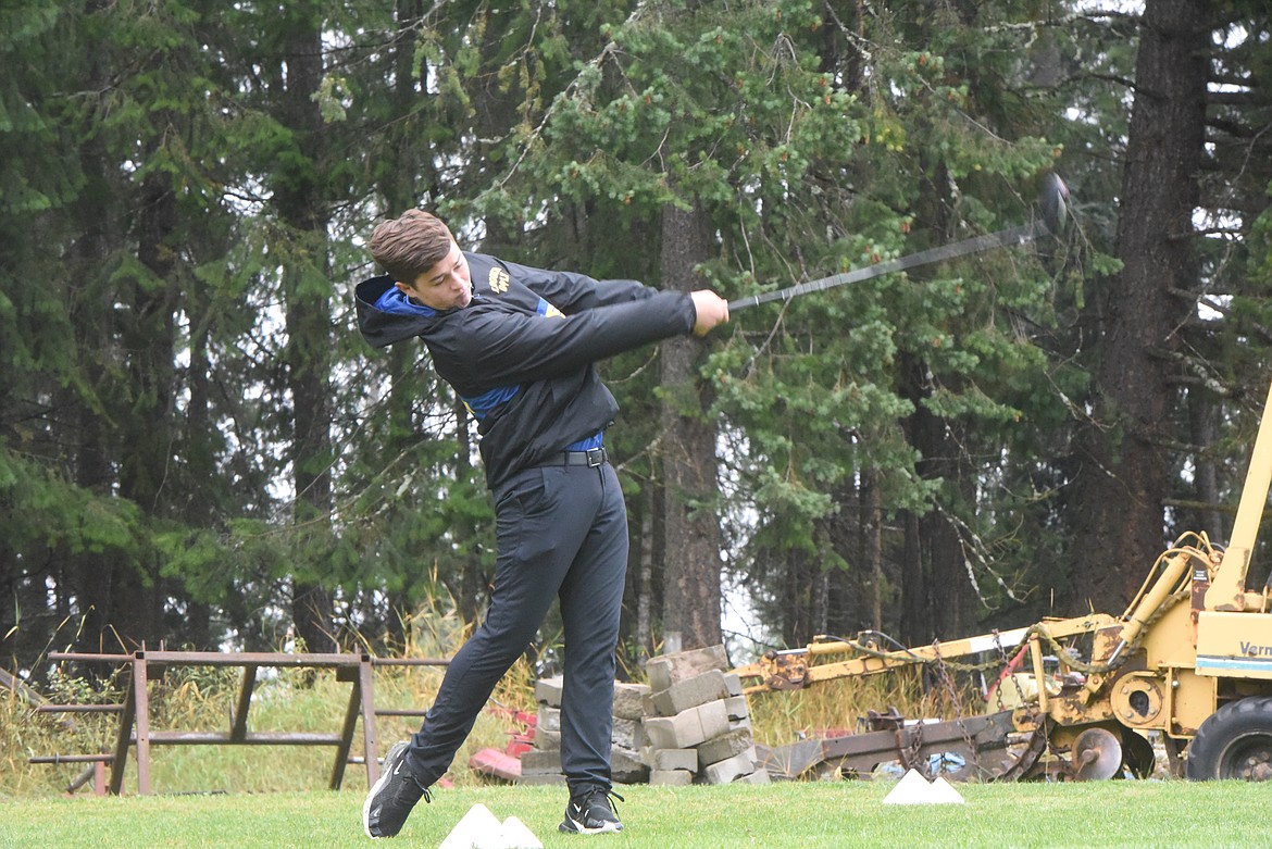 Libby Loggers golfer Mason Gotham tees off at the Western A Divisional Golf Tournament Friday morning at Cabinet View Golf Course. (Scott Shindledecker/The Western News)