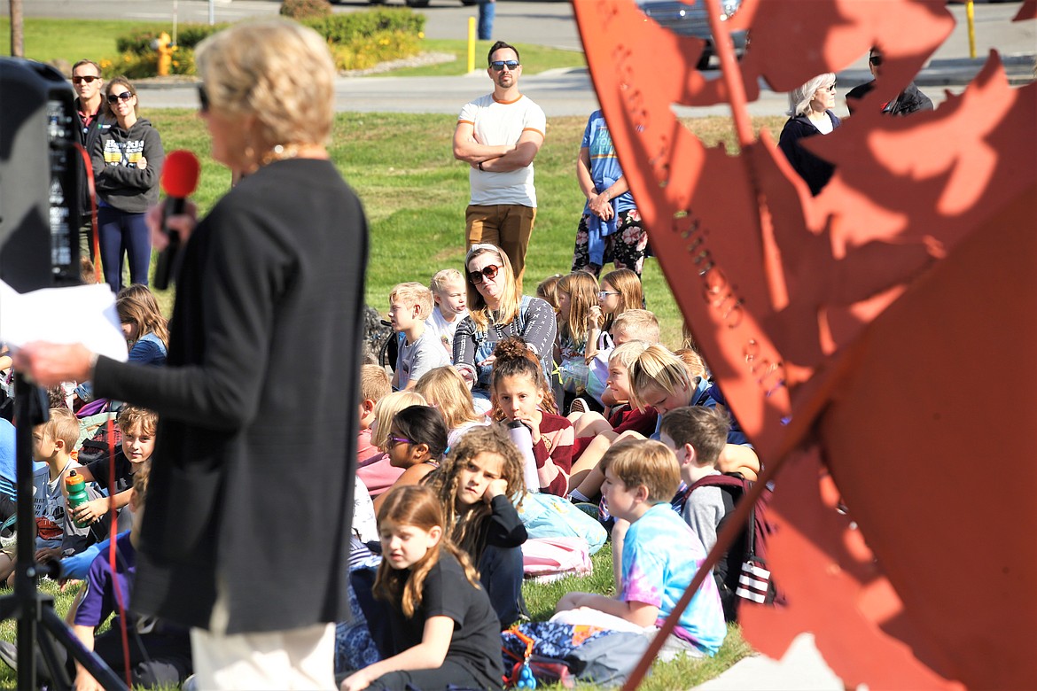 Priscilla Bell shares some remarks during Friday's dedication of the "Monument to Peace and Unity" in Coeur d'Alene.