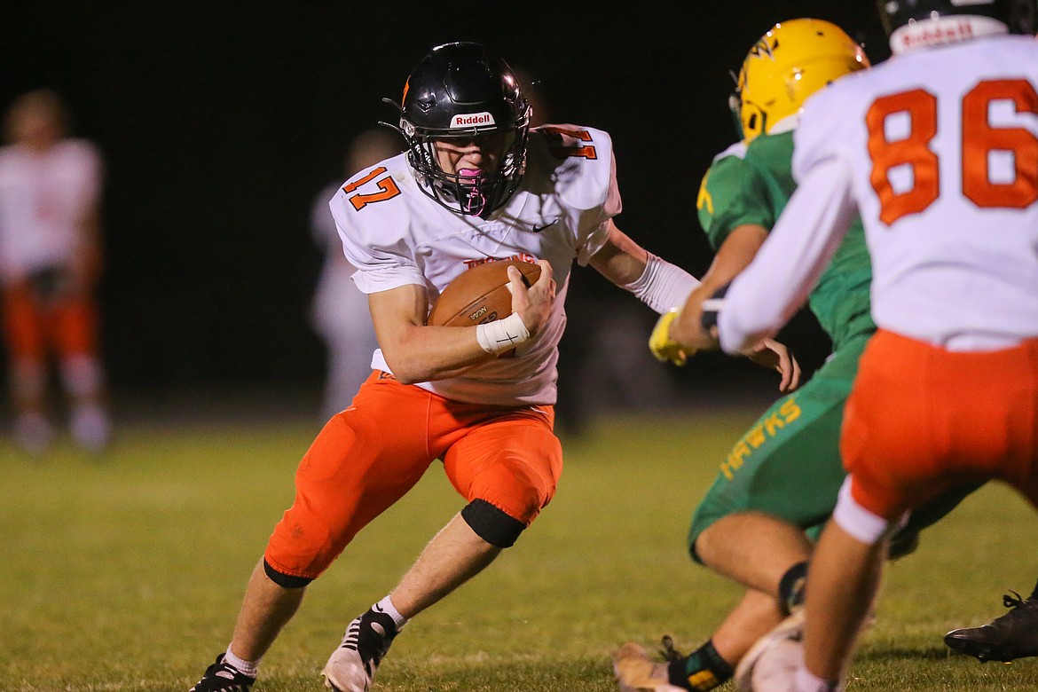 JASON DUCHOW PHOTOGRAPHY
Post Falls running back Tevin Burns looks to break a run during Friday's game against Lakeland at Corbit Field in Rathdrum.