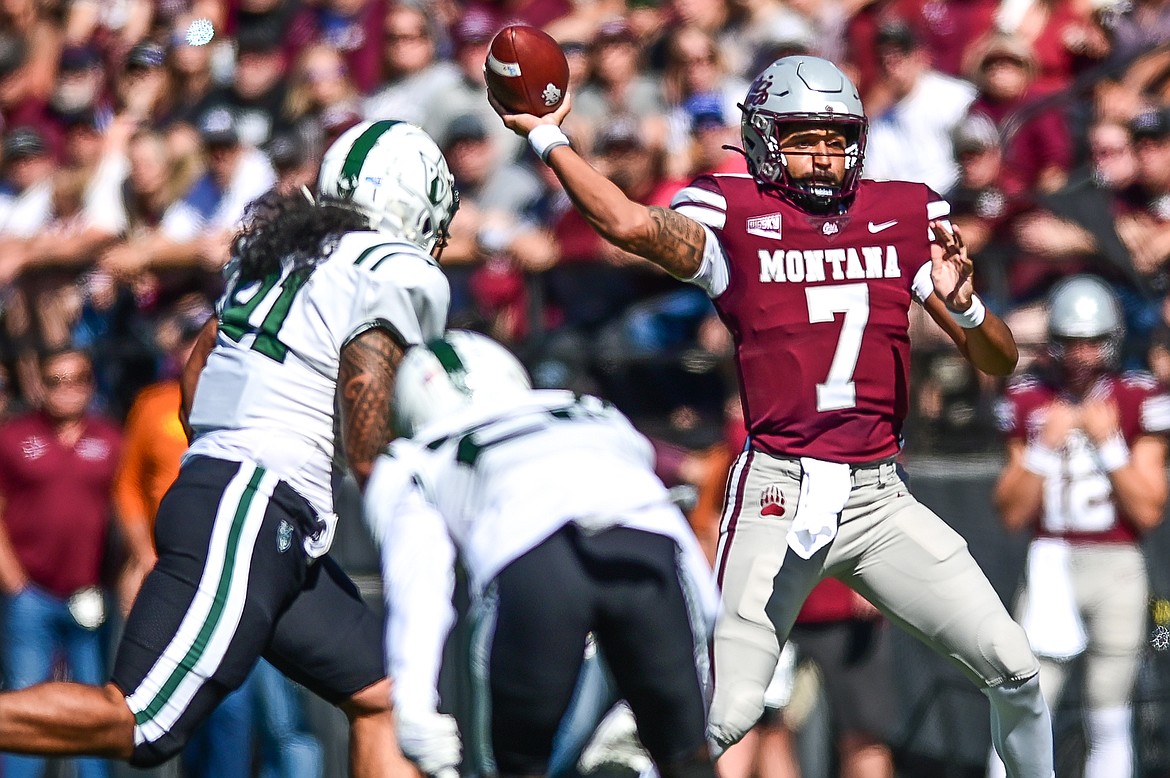 Montana quarterback Lucas Johnson (7) completes a 27-yard pass to receiver Mitch Roberts in the first quarter against Portland State at Washington-Grizzly Stadium on Saturday, Sept. 24. (Casey Kreider/Daily Inter Lake)