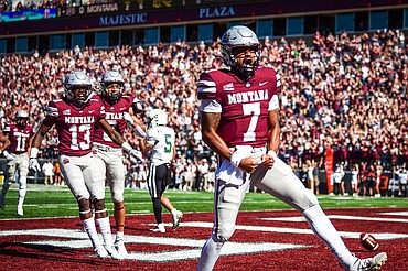 Montana quarterback Lucas Johnson (7) celebrates after an 11-yard touchdown run in the first quarter against Portland State at Washington-Grizzly Stadium on Saturday, Sept. 24. (Casey Kreider/Daily Inter Lake)