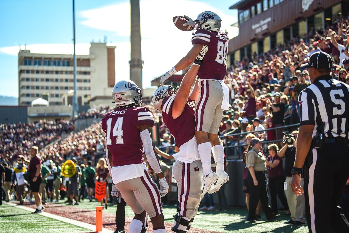Montana wide receiver Mitch Roberts (80) is hoisted into the air by offensive lineman Hunter Mayginnes (61) after a 4-yard touchdown reception from quarterback Lucas Johnson in the second quarter against Portland State at Washington-Grizzly Stadium on Saturday, Sept. 24. (Casey Kreider/Daily Inter Lake)