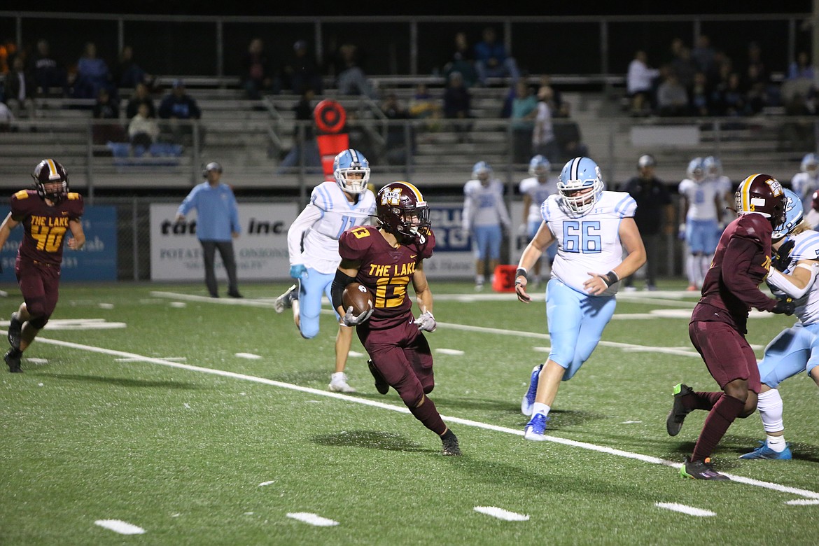 Junior defensive back Hayden Throneberry returns an intercepted pass deep in Moses Lake territory.
