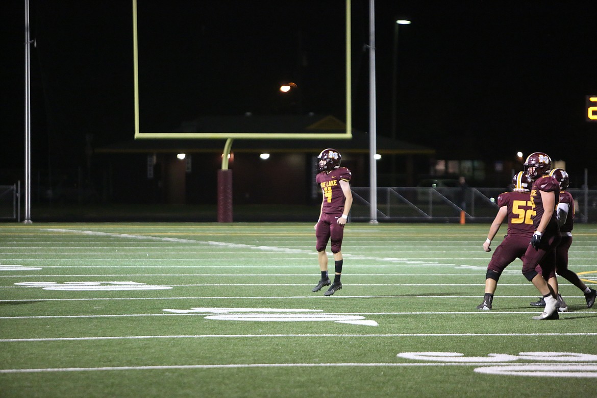 Senior kicker Iden Bone leaps into the air while celebrating his 41-yard field goal during overtime.