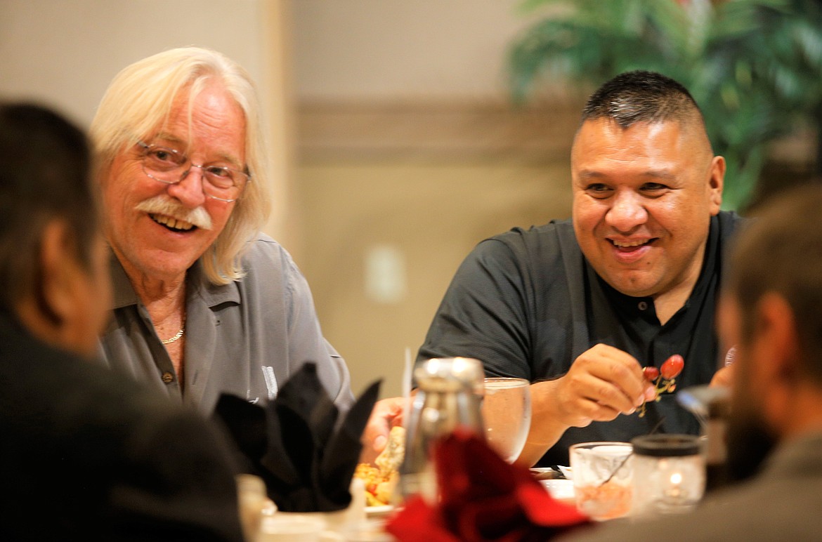 Coeur d'Alene City Councilman Woody McEvers, left, and Chief Allan, chairman of the Coeur d'Alene Tribe, laugh during the Kootenai County Task Force On Human Relations' 23rd annual banquet at The Best Western Plus Coeur d'Alene Inn on Saturday.