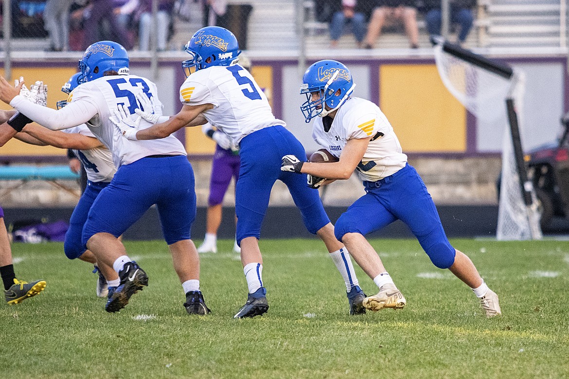 Libby's Xavier Reatz looks for room to run against Polson in Friday's game. The Pirates won 49-0. (Rob Zolman/Lake County Leader)