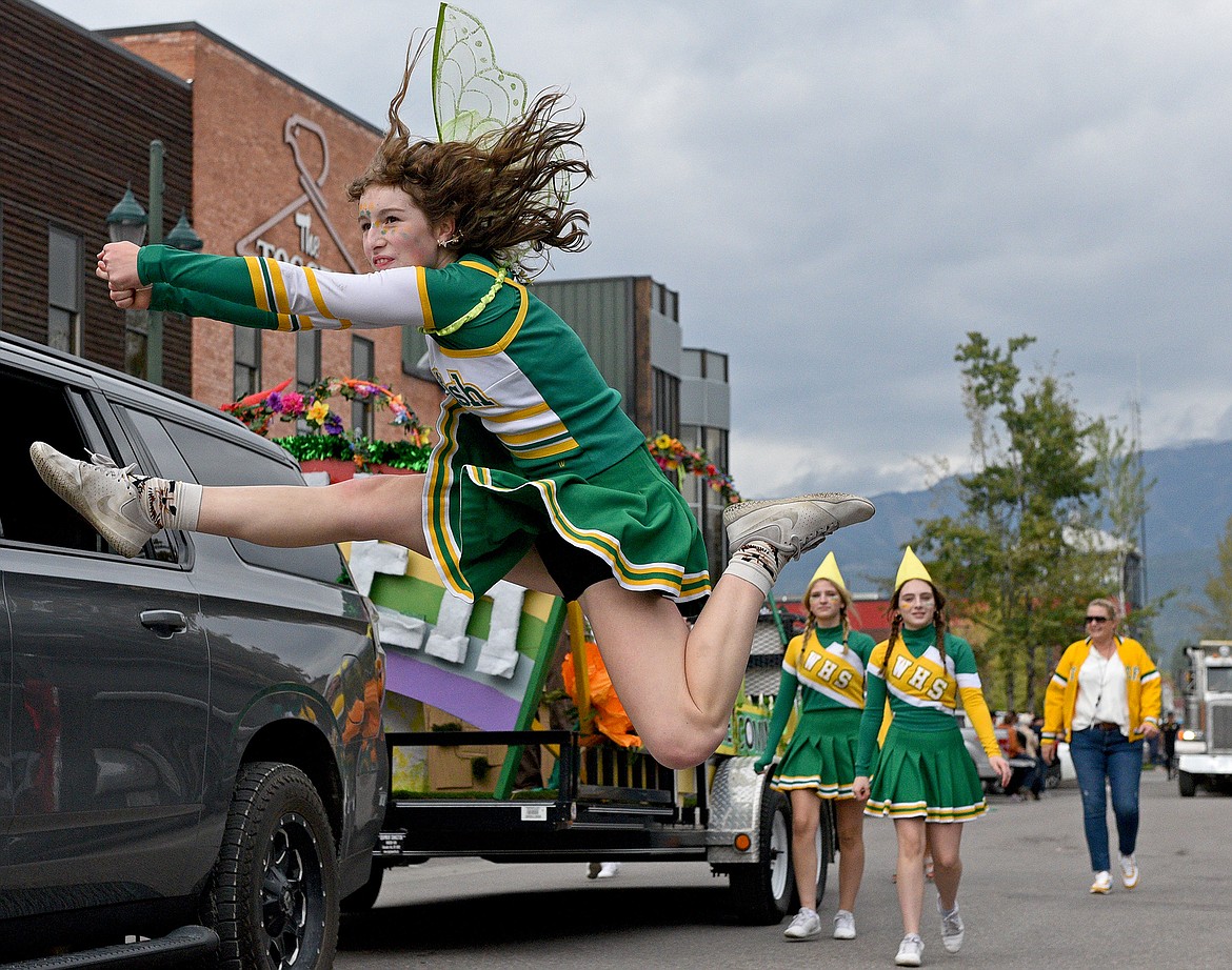 The Whitefish High School cheerleaders stroll down Central Avenue in the 2022 Whitefish Homecoming Parade. (Whitney England/Whitefish Pilot)