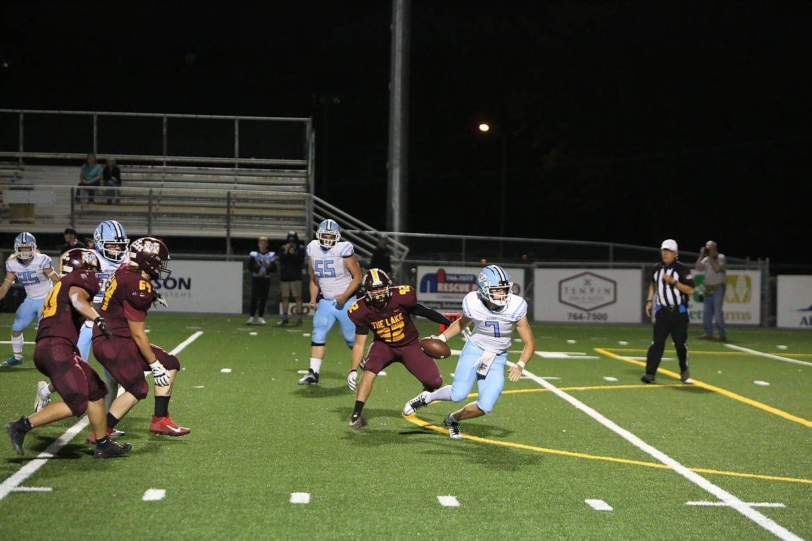 Moses Lake senior Nathan Vlk pressures the Bear quarterback during the Maverick’s overtime win on Friday.