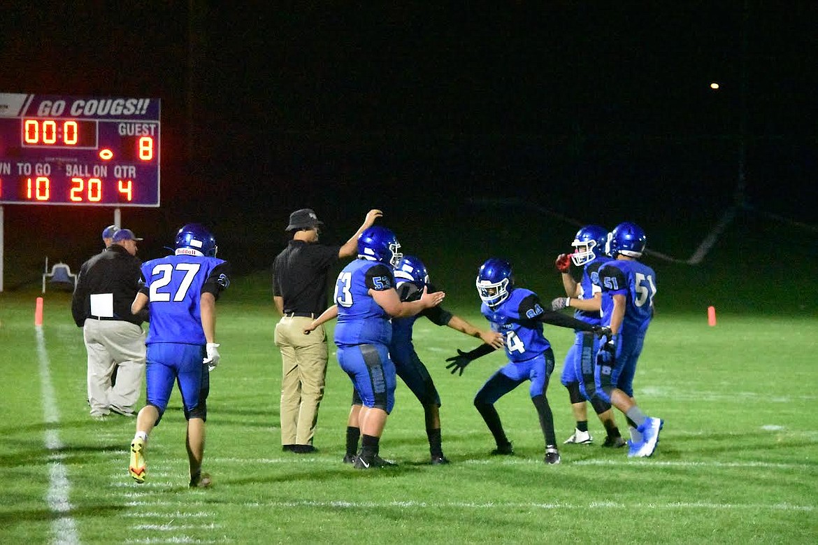 Warden players celebrate the team’s 25-8 win over Granger on Friday.