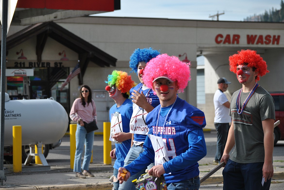 Juniors, Austin Seward, Jaxson Green, Owen Doyle and Wathen Reese clown around during the Superior homecoming parade. (Amy Quinlivan/Mineral Independent)