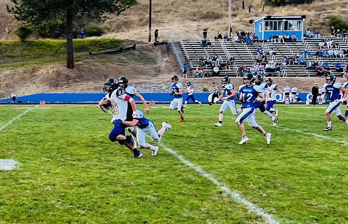 Kellogg runningback Daeton Bauer gets brought to the ground after a 20-yard pickup during Kellogg's big 80-0 win over Orofino.