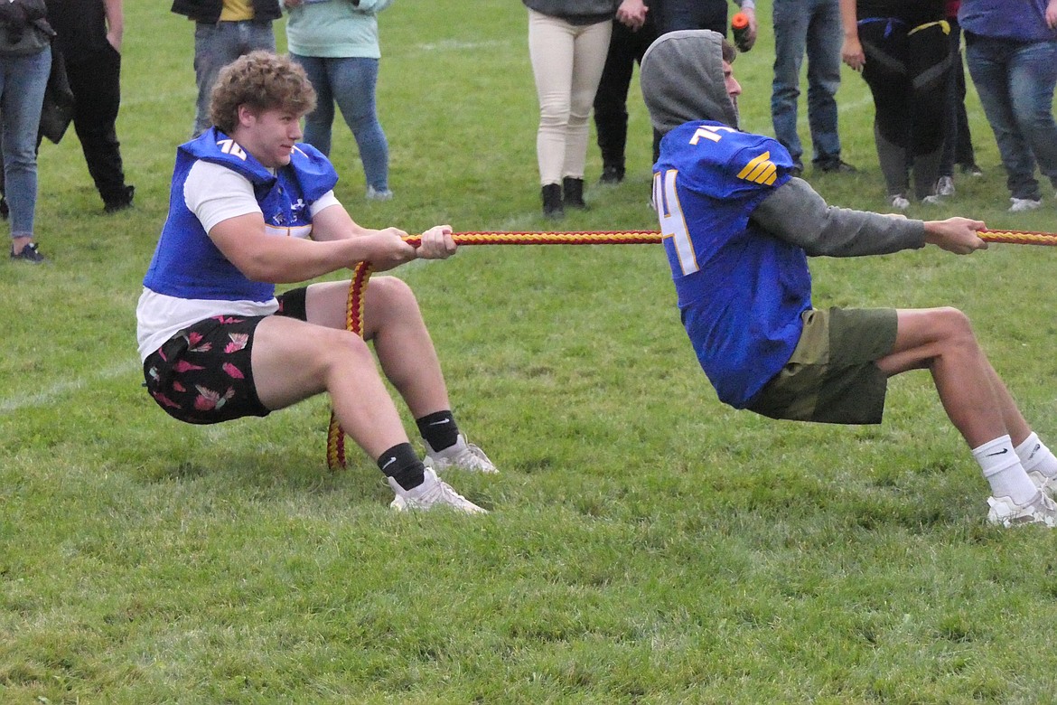 Two members of the Blue Hawks offensive line, Hayden Harris (70) and Gabriel Hutton (74) try to get traction during the annual tug-o-war at Thompson Falls High this past Saturday. (Chuck Bandel, VP-mi)