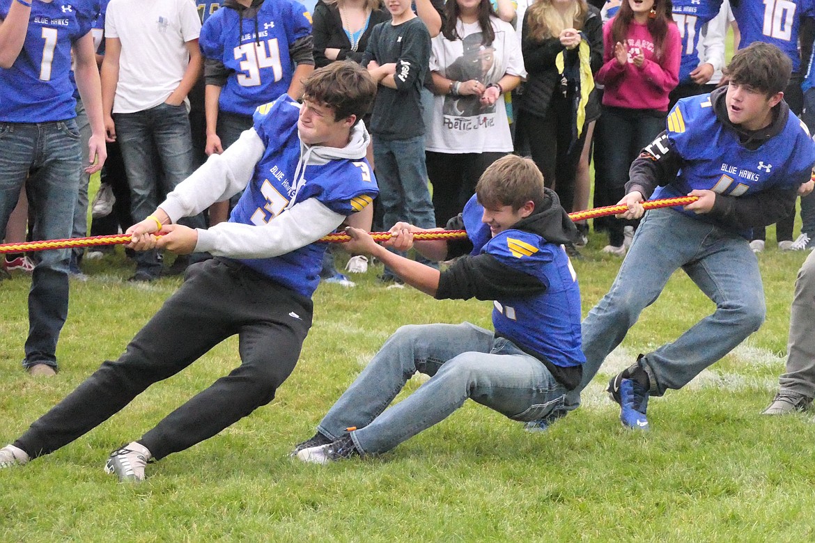 Members of the Thompson Falls sophomore class strain to defeat the junior class in a tug-of-war match during festivities marking this year's homecoming. (Chuck Bandel/VP-MI)