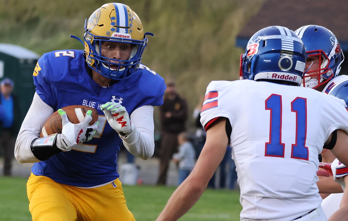 Jesse Claridge gets a carry against the Bigfork defense Friday. (Jeremy Weber/Bigfork Eagle)