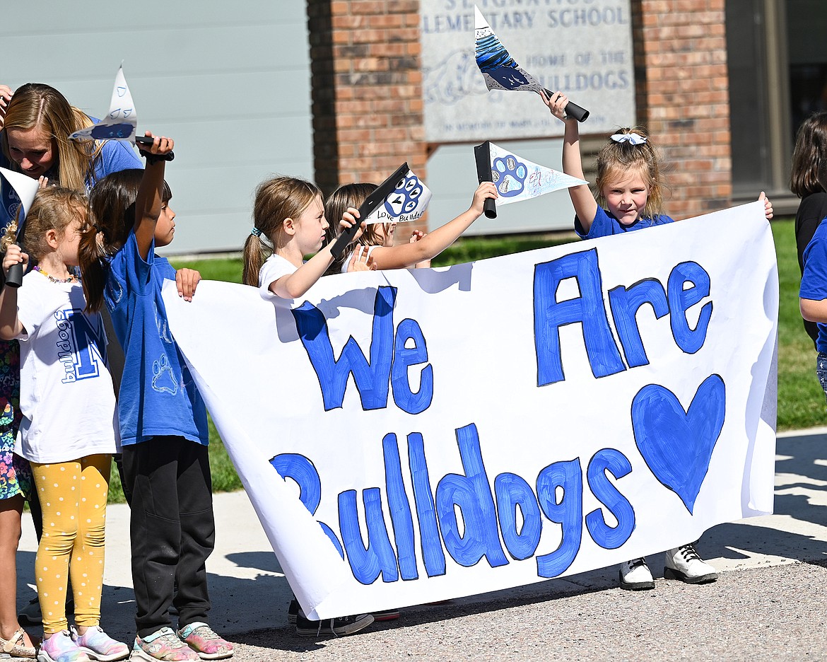 Young Bulldogs show their love during Friday afternoon’s homecoming parade. (Christa Umphrey Photo)