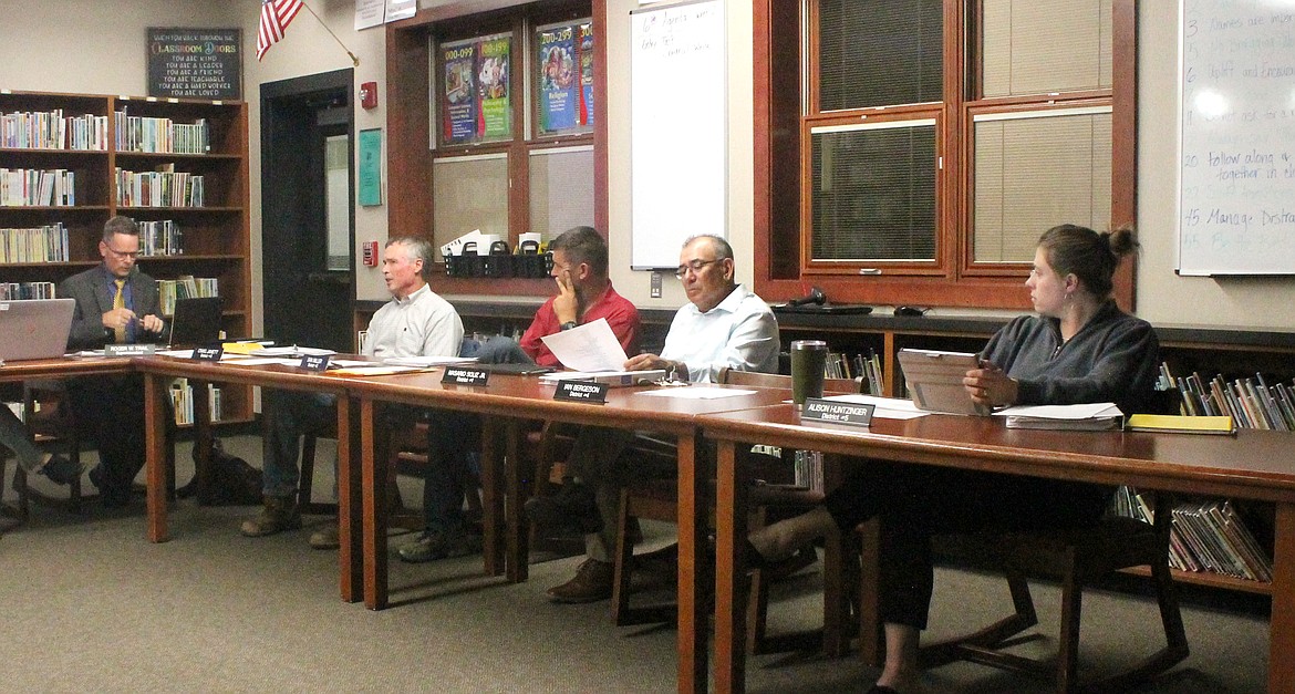 Royal School District superintendent Roger Trail addresses, from left, Royal School Board President Craig Janett and board members Jim Miller, Nasario Soliz Jr. and Alison Huntzinger at the board’s meeting Monday.