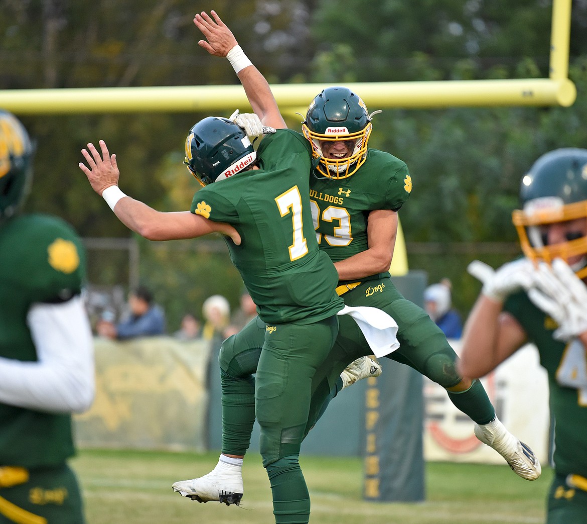 Whitefish's Fynn Ridgeway and Ty Schwaiger celebrate a touchdown in the first half of a game against East Helena on Friday in Whitefish. (Whitney England/Whitefish Pilot)