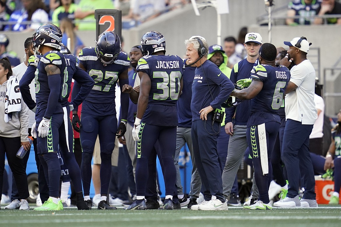 Travis Homer of the Seattle Seahawks runs with the ball in the second