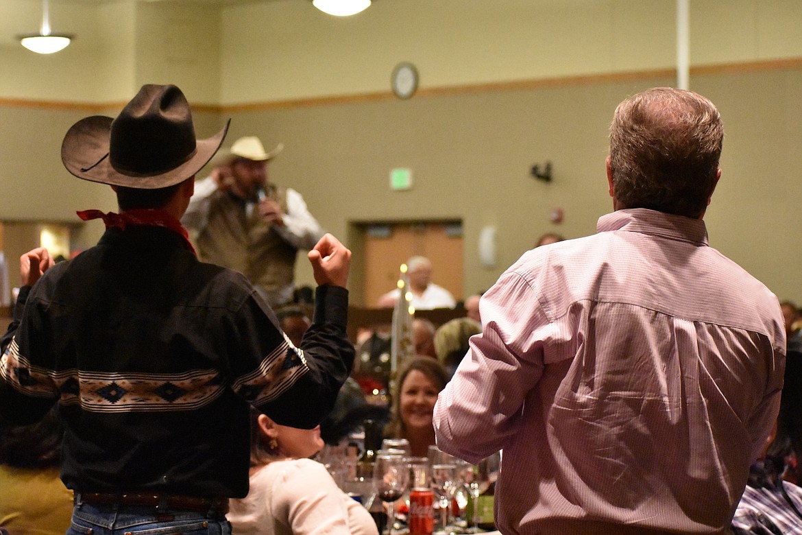 Attendees at the 2019 Boys & Girls Club auction bid at the live auction, conducted by Chuck Yarbro Jr. (background). This year’s auction is Saturday.