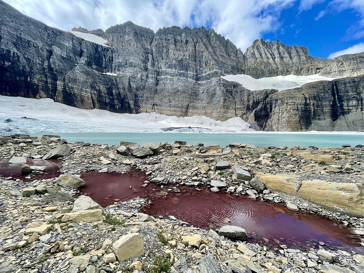 Pigment from algae turns a puddle of melted "watermelon snow" red below Grinnell Glacier in the Many Glacier area of Glacier National Park. (Matt Baldwin/Daily Inter Lake)