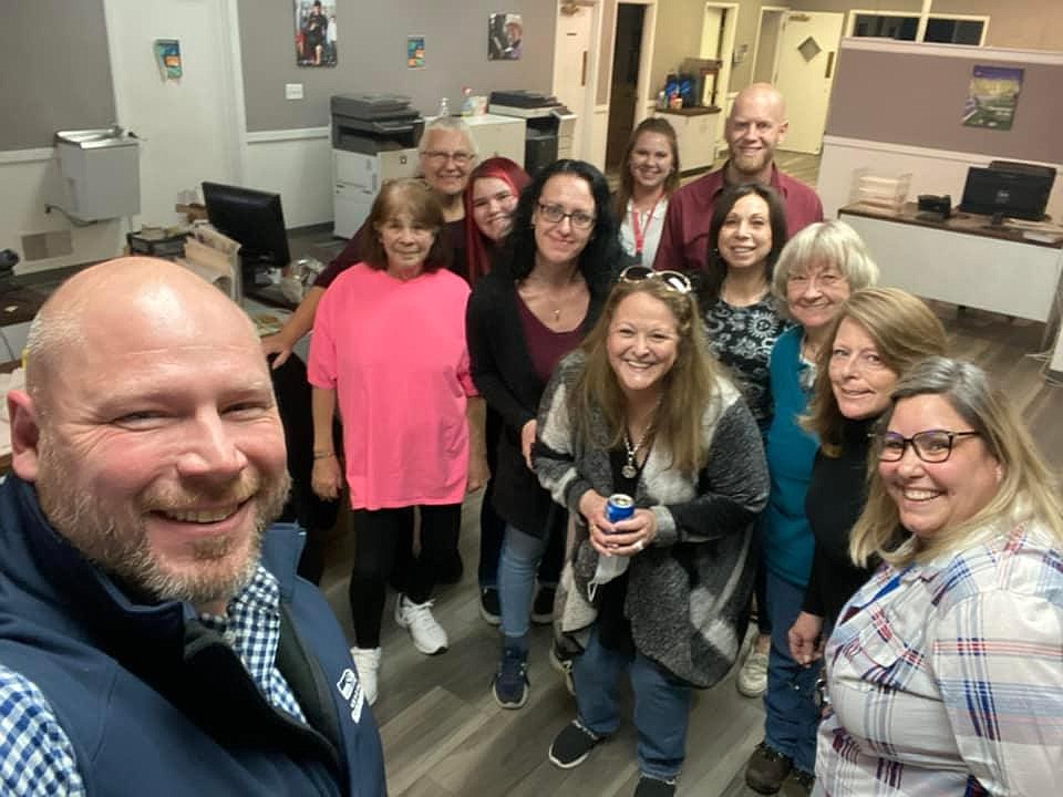 Patti Trujillo, in pink, poses for a selfie with her coworkers at the Columbia Basin Herald where she worked for nearly two decades. Patti was an integral part of the staff at the paper, mentoring new salespeople and making new employees feel welcome. Holding the camera in the front is CBH General Manager Bob Richardson who said Patti was someone he could always count on.