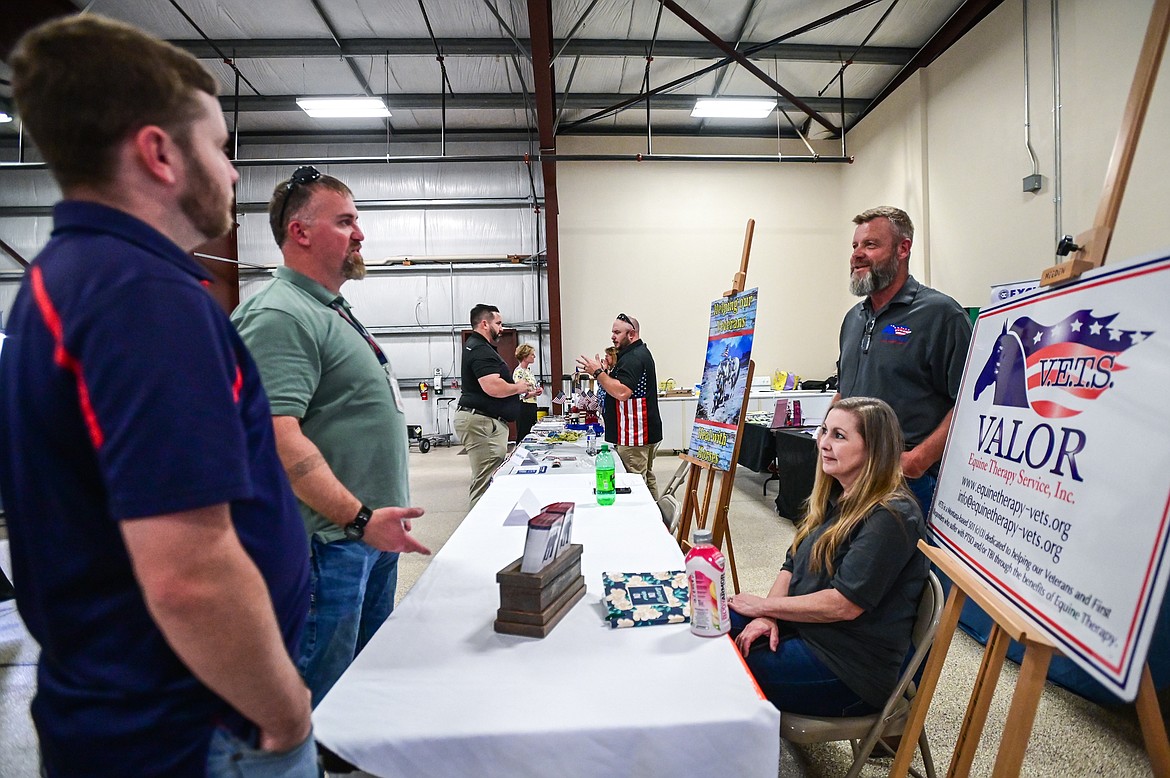 Ingvar and Connie Ingvarsson, with V.E.T.S. Valor Equine Therapy Service, speak with attendees at the 2022 Job & Veteran Opportunity Fair at the Flathead County Fairgrounds Expo Building on Wednesday, Sept. 28. (Casey Kreider/Daily Inter Lake)