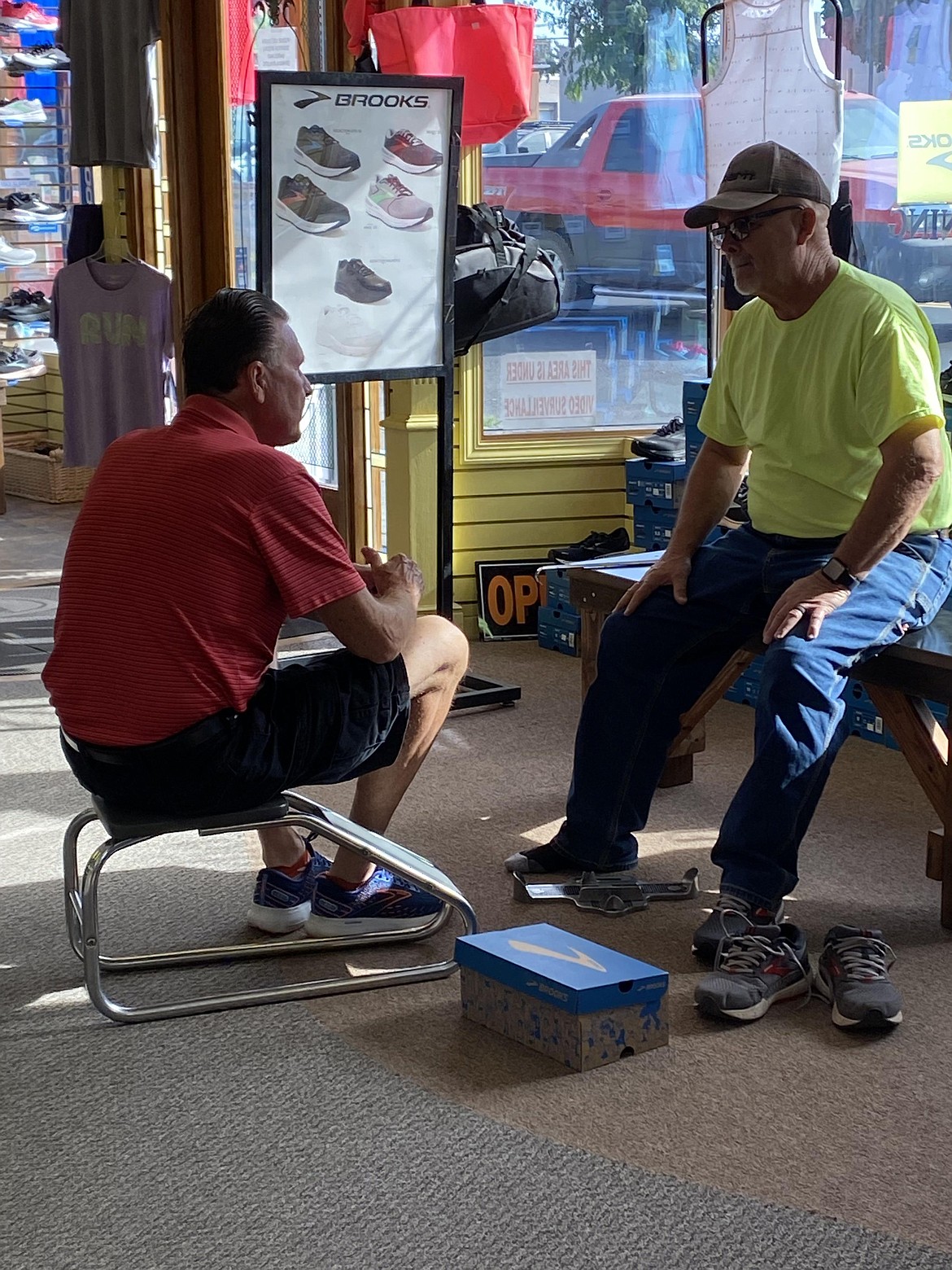 Ephrata business owner Mike Scellick sits down with a customer and helps him find a pair of running shoes that fit both his feet and his fitness plans.