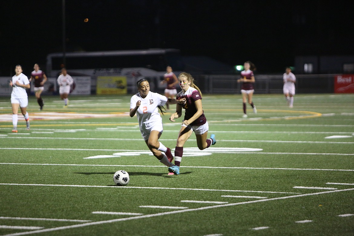 Moses Lake’s Reese Prescott advances the ball upfield during the Mavericks’ 3-0 win over Davis. Prescott later scored a goal in the 74th minute.