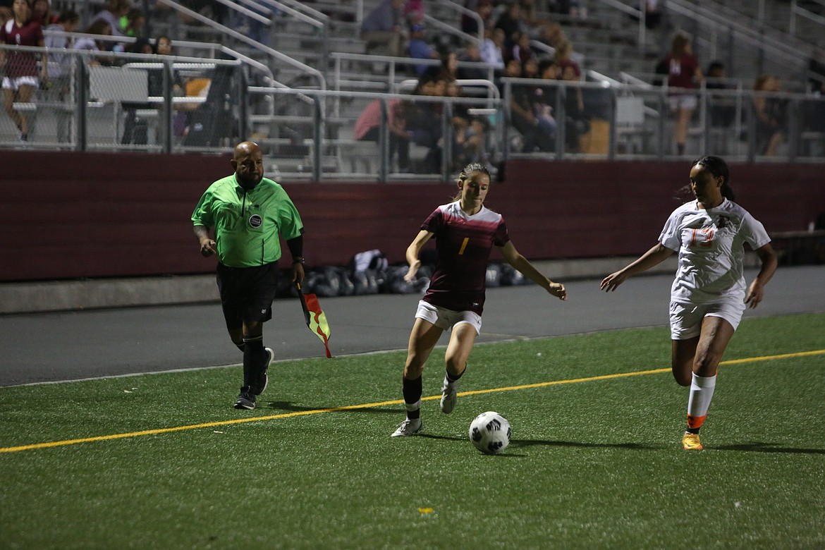 Moses Lake’s Maite Betes looks to get past a Davis defender late in the match on Tuesday.