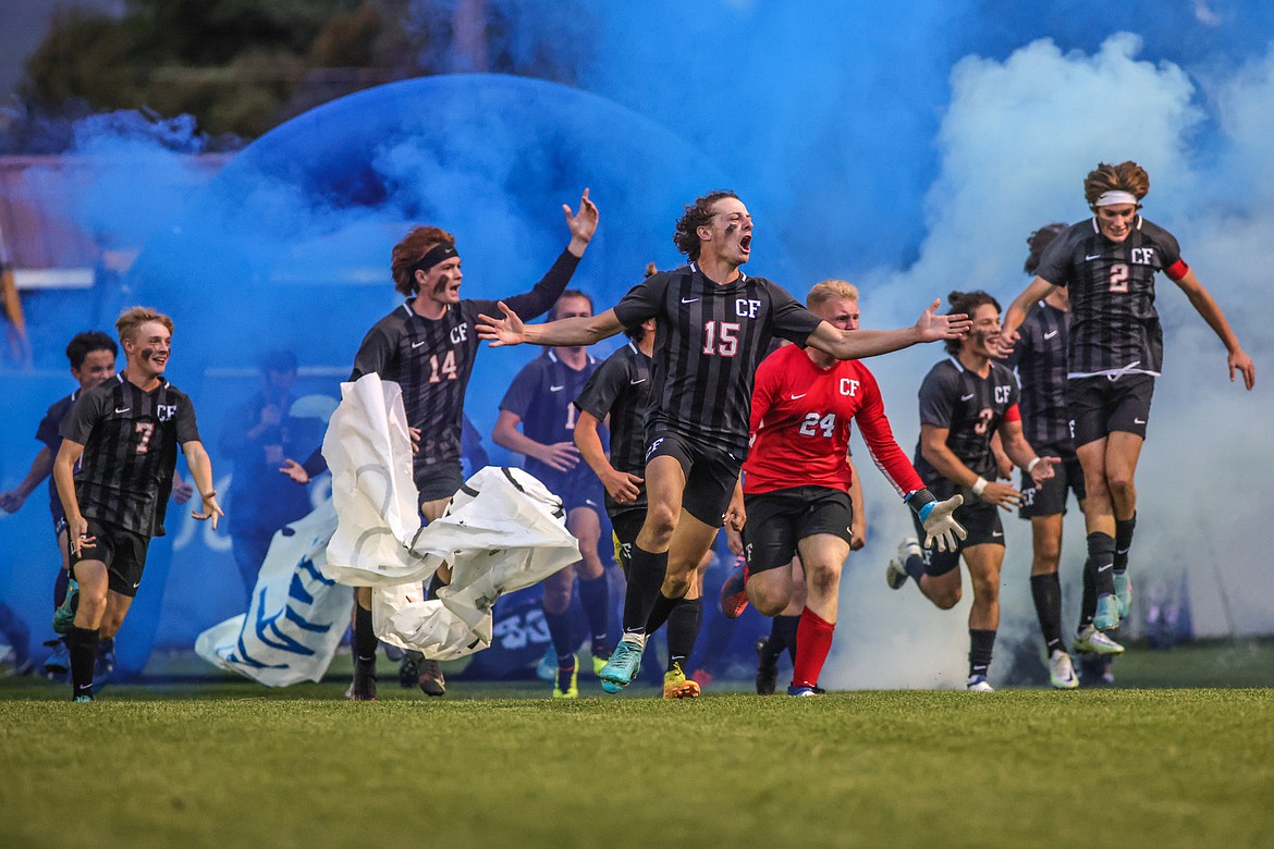 The Columbia Falls Wildcats run through the tunnel at their homecoming game against the Whitefish Bulldogs at Flip Darling Memorial Field on Thursday, Sept. 29. (JP Edge/Hungry Horse News)