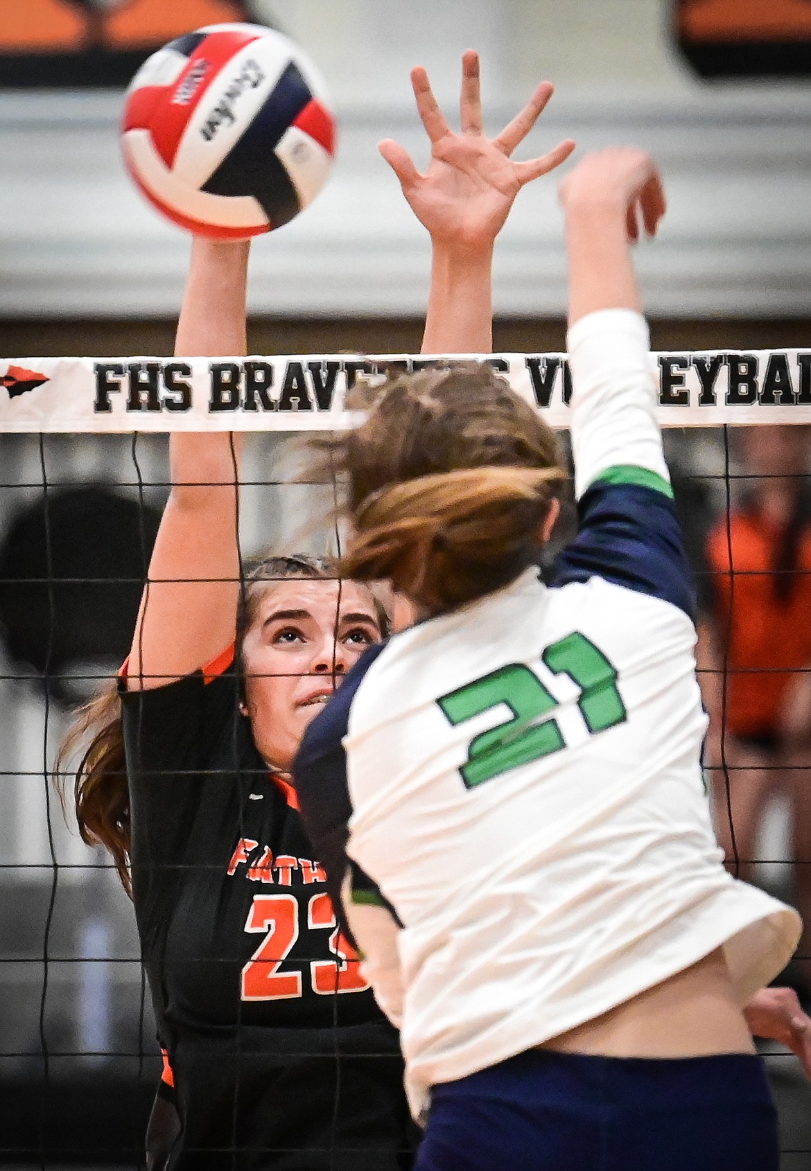 Flathead's Sienna Sterck (23) goes up for a block against Glacier's Kaylei Fant (21) during crosstown volleyball at Flathead High School on Thursday, Sept. 29. (Casey Kreider/Daily Inter Lake)