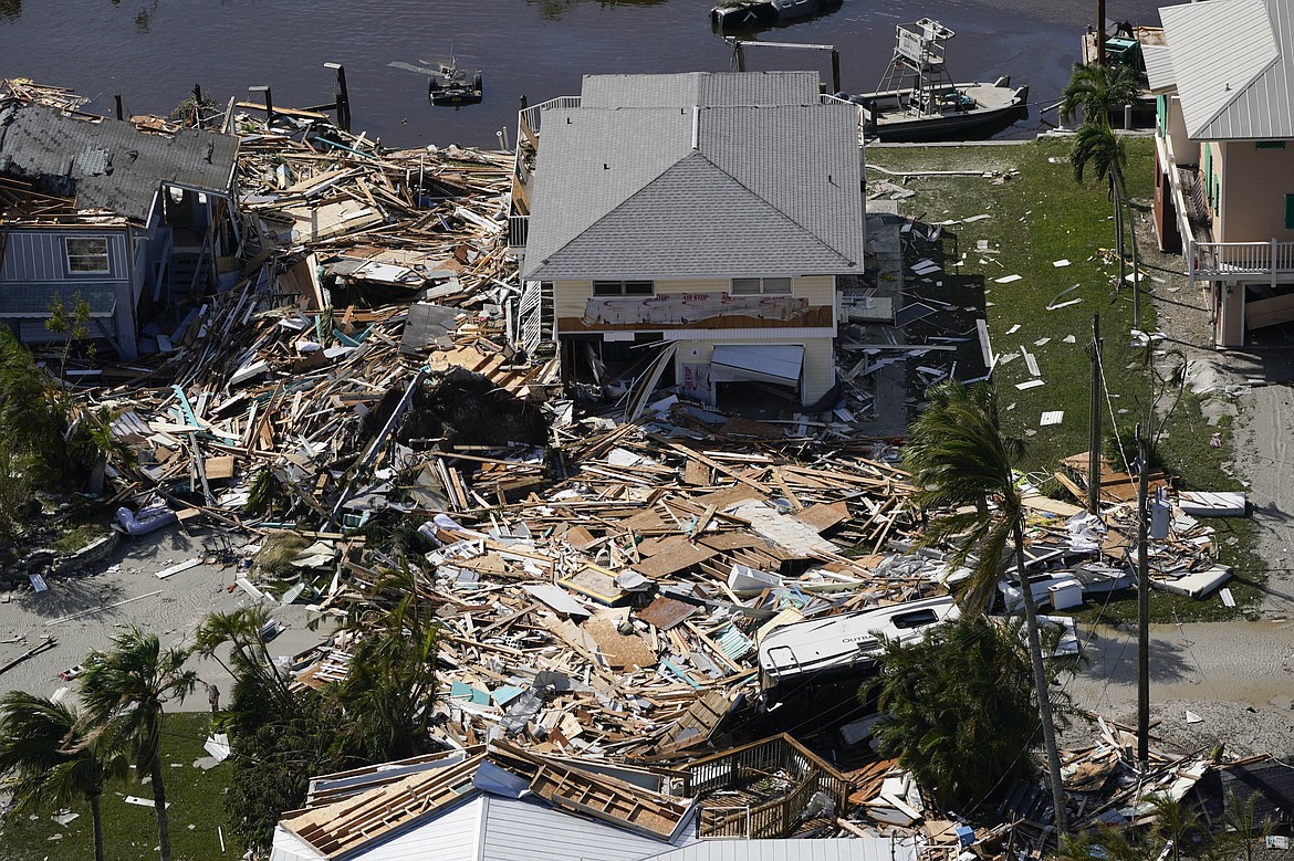 Damaged homes are seen in the aftermath of Hurricane Ian, Thursday, Sept. 29, 2022, in Fort Myers Beach, Fla. (AP Photo/Wilfredo Lee)